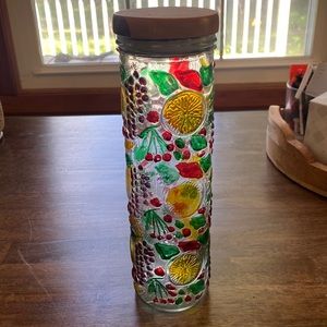 Glass container with assorted fruit decoration